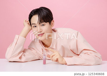 Portrait of a young man posing with his eyebrows 125340608