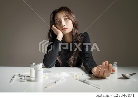 A young man in his 20s addicted to various drugs and drugs A young man in his 20s addicted to various drugs and drugs 125340871