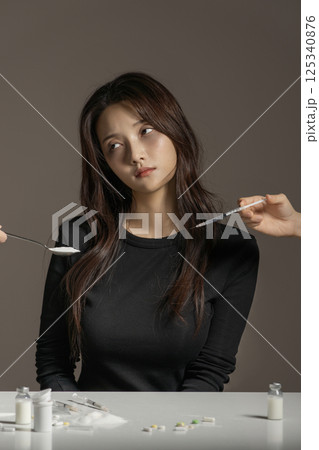 A young man in his 20s addicted to various drugs and drugs A young man in his 20s addicted to various drugs and drugs 125340876