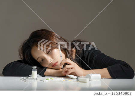 A young man in his 20s addicted to various drugs and drugs 125340902