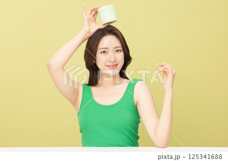 A pretty woman holding eco-friendly basic cosmetics A pretty woman holding eco-friendly basic cosmetics 125341688