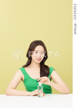 A pretty woman holding eco-friendly basic cosmetics 125341813