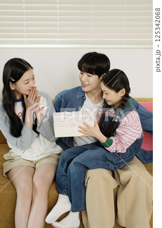 Parents nursing their sick child 125342068