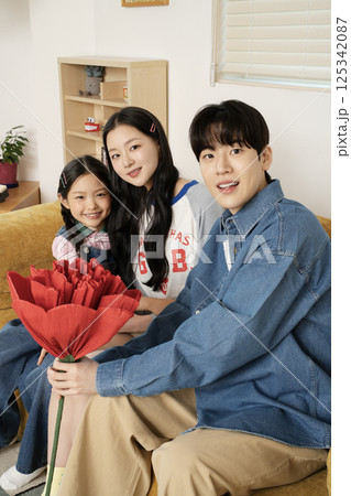 Family playing in bed Family playing in bed 125342087