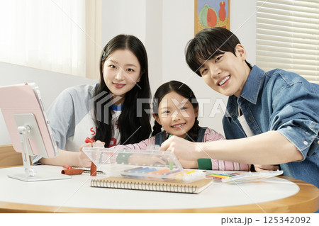 Family playing in bed Family playing in bed 125342092