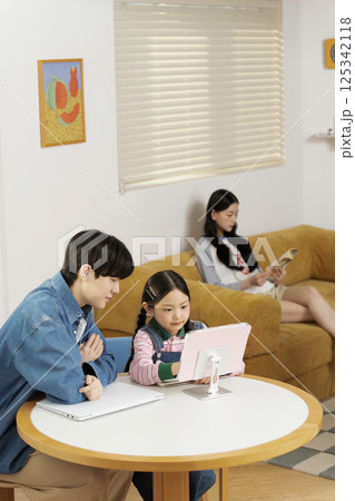 Man listening to music and eating cookies in bed Man listening to music and eating cookies in bed 125342118