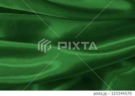 Dark green fabric cloth texture for background and design art work, beautiful crumpled pattern of silk or linen. 125344570