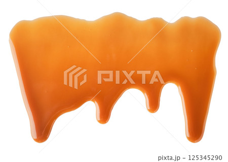 Dripping Melted caramel sauce abstract drops on white background Dripping Melted caramel sauce abstract drops on white background 125345290
