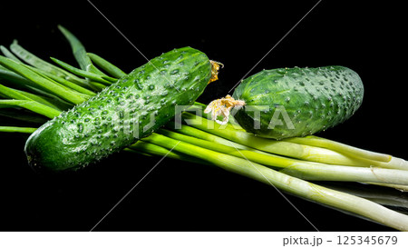 Fresh Cucumbers with Dew Drops on Black Background Fresh Cucumbers with Dew Drops on Black Background 125345679