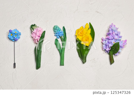 Variations of brooches in the form of flowers Variations of brooches in the form of flowers 125347326