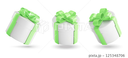 Round gift boxes with green ribbons and bows. Round gift boxes with green ribbons and bows. 125348706