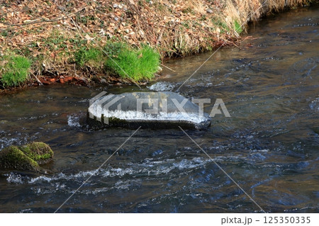 The Yu River, Yu Kawa, in Karuizawa, Nagano prefecture Japan near the Hoshino Resort with rocks stained white from the hot springs The Yu River, Yu Kawa, in Karuizawa, Nagano prefecture Japan near the Hoshino Resort with rocks stained white from the hot springs 125350335
