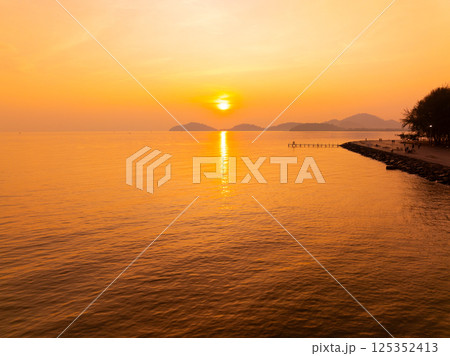 Amazing sunset or sunrise sky over sea landscape,Beautiful colorful light of nature background,Drone camera shot nature view seascape 125352413