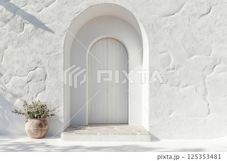 White arched doorway with terracotta pot and stairs 125353481
