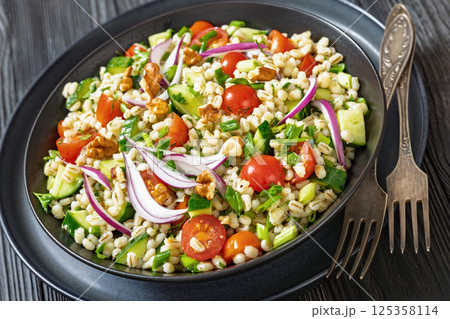 Barley salad with vegetables and walnuts in a bowl Barley salad with vegetables and walnuts in a bowl 125358114