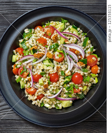 Barley salad with vegetables and walnuts in a bowl Barley salad with vegetables and walnuts in a bowl 125358115