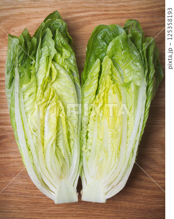 roman lettuce on cutting board 125358193
