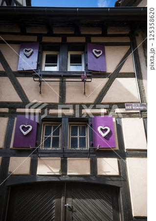 Romantic building with heart shutters in Riquewihr, Alsace, France 125358620