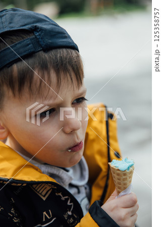 boy eating delicious ice cream 125358757