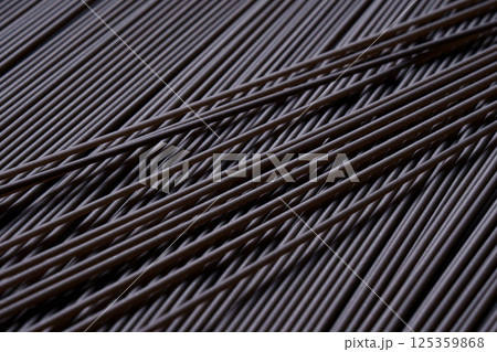 Raw black spaghetti with cuttlefish ink. Close-up of the dish. 125359868