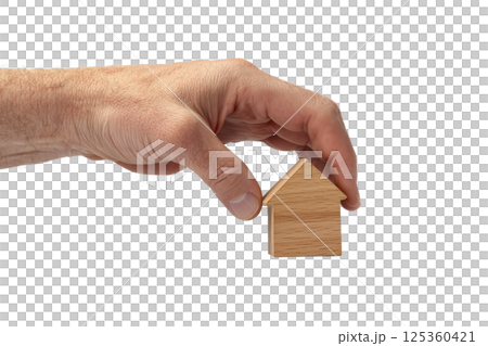 hand firmly grasping a small home model, symbolizing property ownership, isolated on a white background 125360421