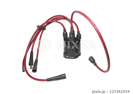 ignition wires, installed in distributor cap, isolated on white background ignition wires, installed in distributor cap, isolated on white background 125362034