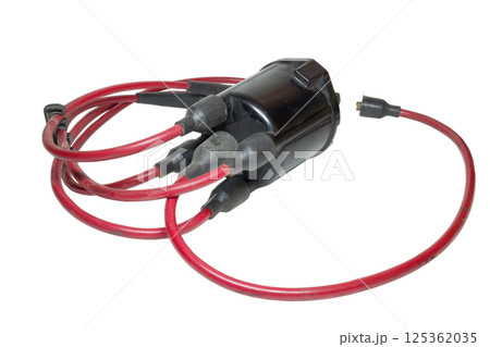 spark plug wires, installed in ignition distributor cap, isolated on white background 125362035