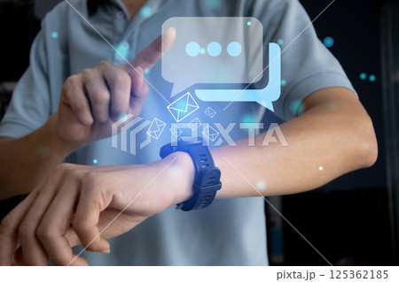 Business concept using smartwatch to communicate and reply to messages Business concept using smartwatch to communicate and reply to messages 125362185