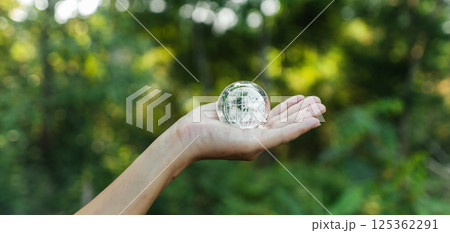 Protecting the world and the environment concept, globe in hand 125362291