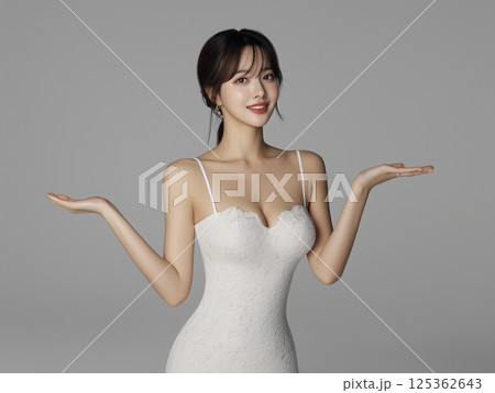 Woman in a white dress is holding her hands up in the air 125362643