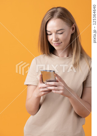 Young Woman Using Smartphone 125364640