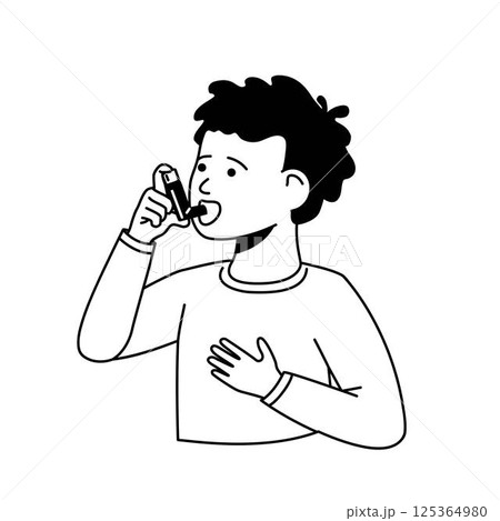 A boy treats his asthma with an inhaler. 125364980