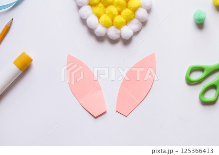 Step by step instruction. Making of handmade Easter egg from pompons. DIY Kids Craft concept. Step by step 4 Step by step instruction. Making of handmade Easter egg from pompons. DIY Kids Craft concept. Step by step 4 125366413