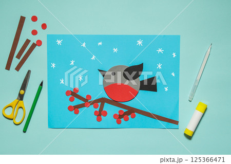 Winter bird bullfinch made of paper. Winter Craft kids. Workshop. Kindergarten and school. Winter bird bullfinch made of paper. Winter Craft kids. Workshop. Kindergarten and school. 125366471