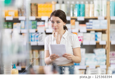 woman holds a medical prescription in her hands 125368394