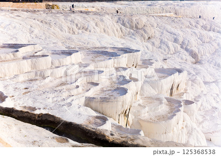 Carbonate travertines the natural pools during. Turkey 125368538