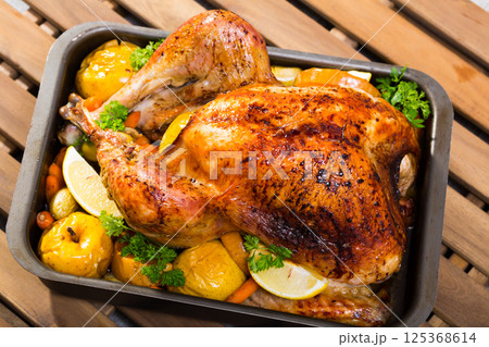 Roasted turkey with baked apples 125368614