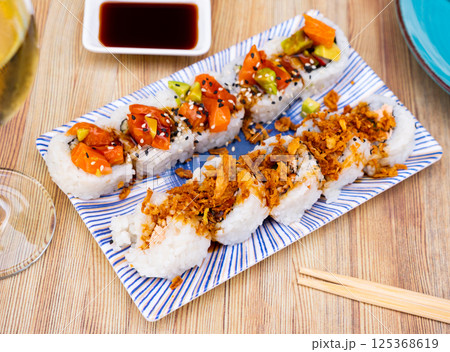 Popular Japanese dish is Uramaki rolls and Saketaki rolls 125368619
