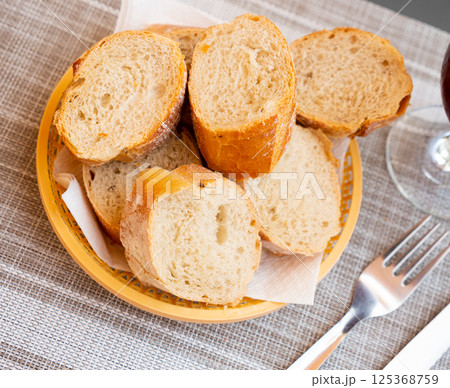 Served bread in wicker plate 125368759