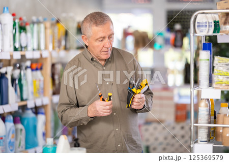 man chooses tools for the house 125369579