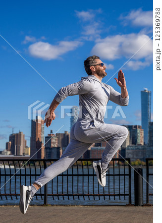 Morning sport workout runner running. Sport runner in Manhattan. Sportsman in New York. Man sportsman running for exercise in active wear. Sportsman jogger running. Sport lifestyle 125369788