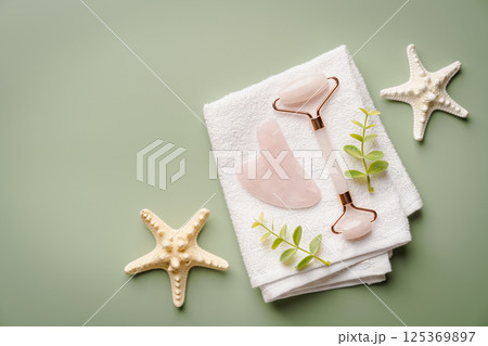 Jade face rollers and Gua sha stones Jade face rollers and Gua sha stones 125369897