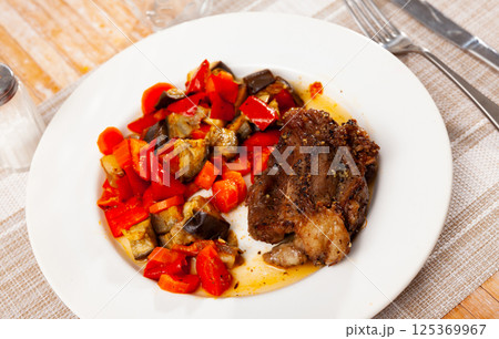 Baked pork cheek with stewed vegetables 125369967
