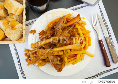 Lamb on the bone with potatoes. Spanish dish 125370639