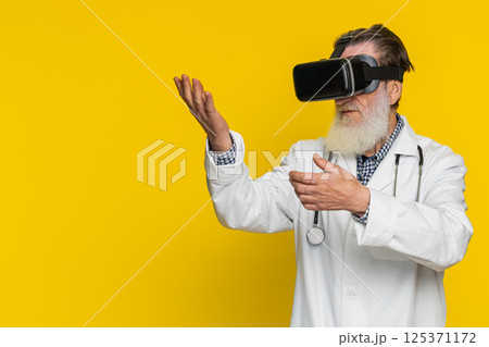 Excited doctor in VR goggles man using headset helmet app, watching virtual reality 3D 360 video 125371172