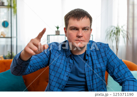 Irritated displeased aggressive unhappy man gesturing hands blaming scolding for failure problem Irritated displeased aggressive unhappy man gesturing hands blaming scolding for failure problem 125371190
