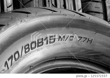 Road motorcycle rear tire size label on tire sidewall, width, height and diameter, big bike tire Road motorcycle rear tire size label on tire sidewall, width, height and diameter, big bike tire 125372337