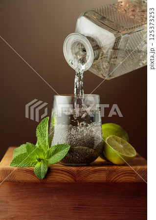 Diet cocktail with chia seeds, lime, and mint. 125373253