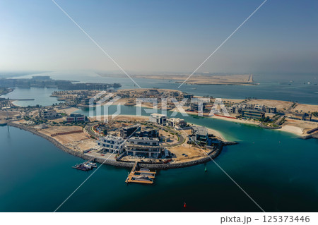 Construction Dubai Palm island from above. 125373446