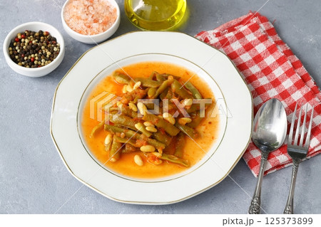 Homemade stewed green beans, tomatoes, garlic with olive oil. Zeytinyagli fasulye traditional food 125373899